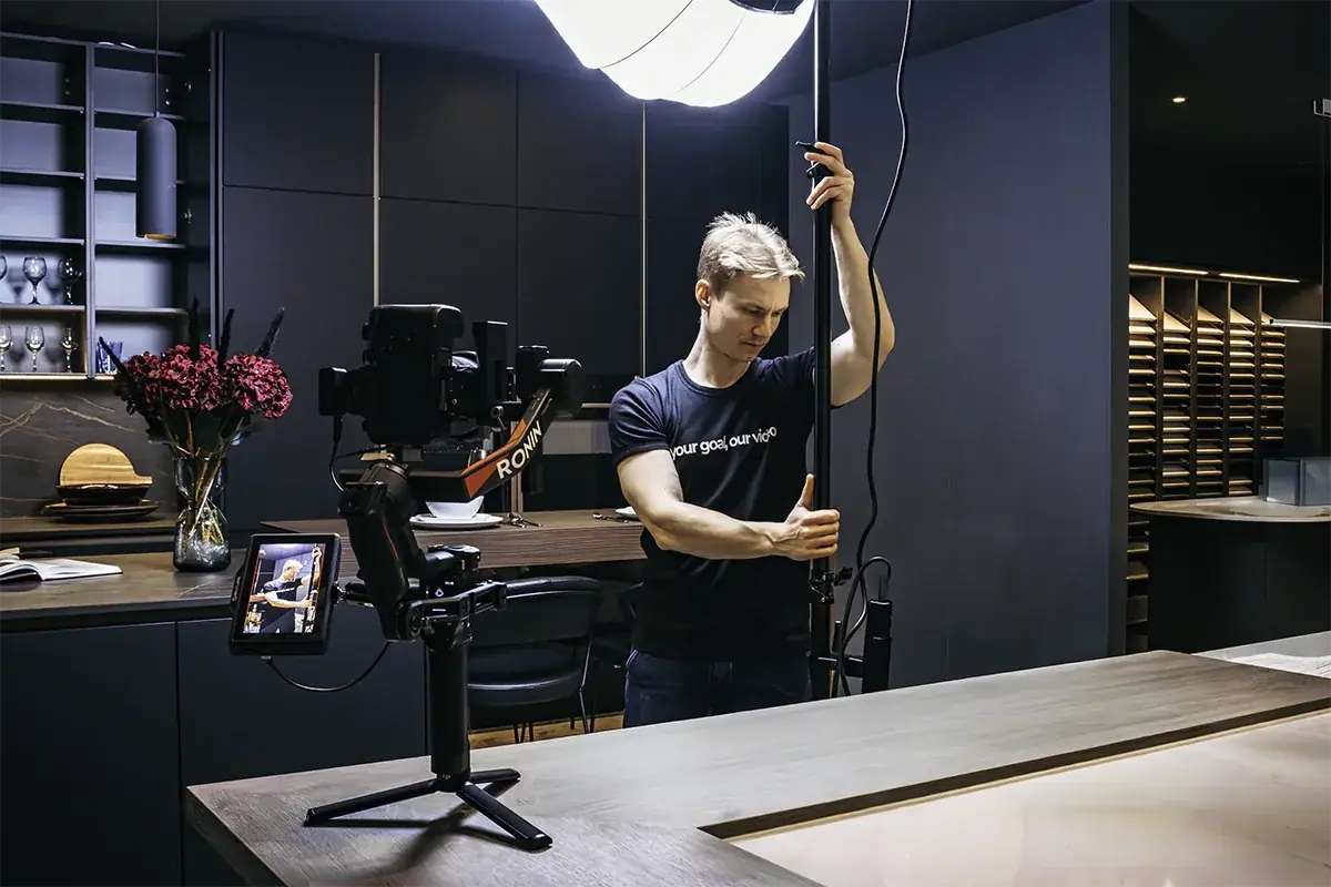 Camera operator framing a multi-format shot